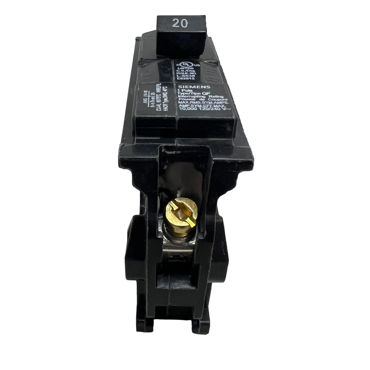 A black 20A circuit breaker with a gold screw terminal and white printed specifications, photographed on a light gray surface.